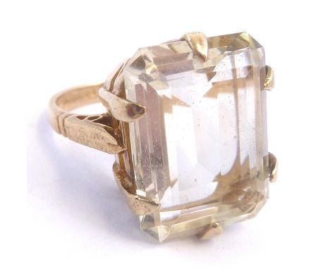 A 9-carat yellow gold ring set with an emerald-cut stone (possibly citrine)  (The cost of UK postage via Royal Mail Special D