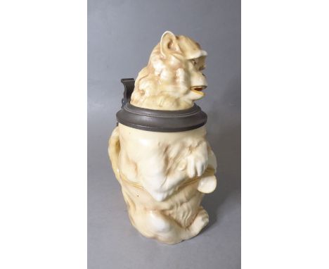 A hand-decorated Musterschutz (German)&nbsp;porcelain&nbsp;half-litre&nbsp;tankard;&nbsp;modelled as a seated monkey holding 