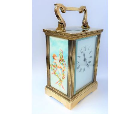 A good early 20th century carriage clock; the folding handle above a white-enamel dial with Roman numerals, two opposing rect