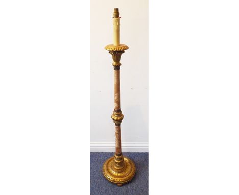 A parcel-gilt lamp standard; circular base raised on three bun-style feet (136cm including light fitting)