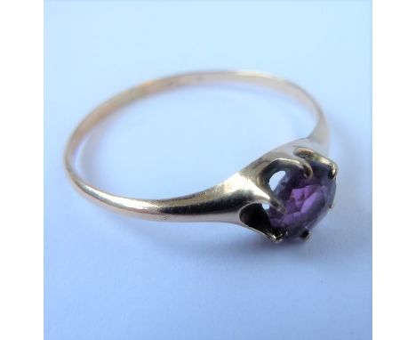 A 9-carat gold (marks rubbed) dress ring set with an amethyst (boxed)  (The cost of UK postage via Royal Mail Special Deliver