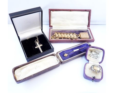 Four items of cased jewellery: a Victorian pinchbeck fob upon a chain; a modern crucifix on chain; a 9-carat stick pin, the l