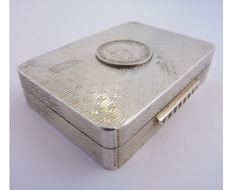 A rectangular textured silver snuff/pill box, Edinburgh Millennium hallmark, George V coin applied to the top