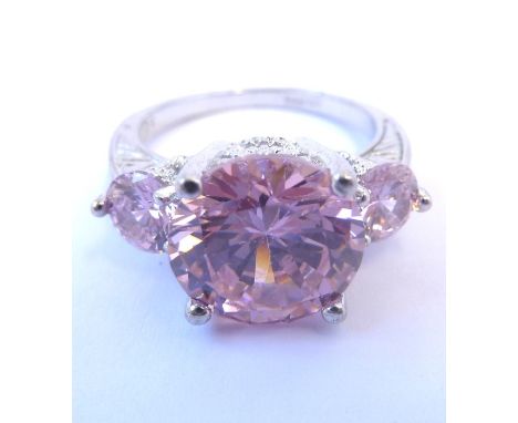 A 9-carat white-gold ring set with three pink topaz stones (possibly pink topaz but untested)  (The cost of UK postage via Ro