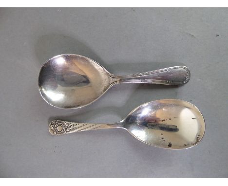 Two silver caddy spoons: Sheffield 1896 with maker's mark WSS and Sheffield 1944 with maker's mark MC (27.4g)