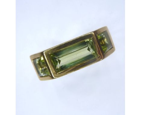An 18-carat yellow gold and peridot ring by 'Tiffany', signed, convention hallmark  (The cost of UK postage via Royal Mail Sp