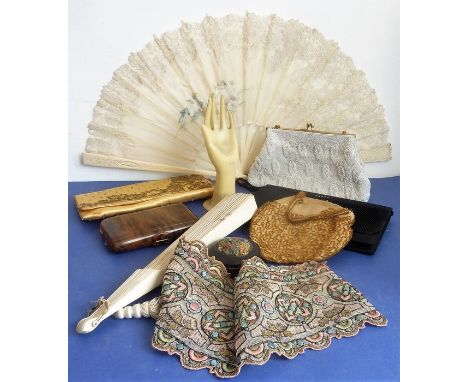 Interesting collectable items to include two fans, a ring-stand in the form of a hand (probably mid-20th century), a faux tor