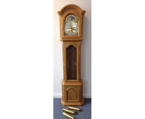 A fine and modern solid oak-cased eight-day longcase clock; the broken arch dial with moon phase mechanism and subsidiary han