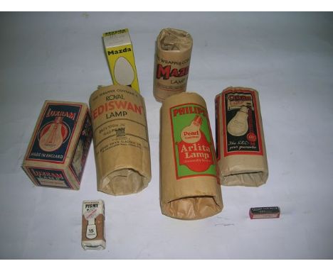 A collection of eight electric light bulbs mainly in original tissue and card wrappings to include lamps manufactured by Phil