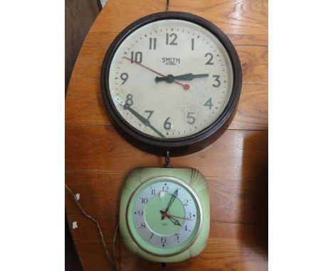 A Smiths Sectric vintage wall clock in a green moulded plastic case, together with a further Smiths Sectric dial clock with c