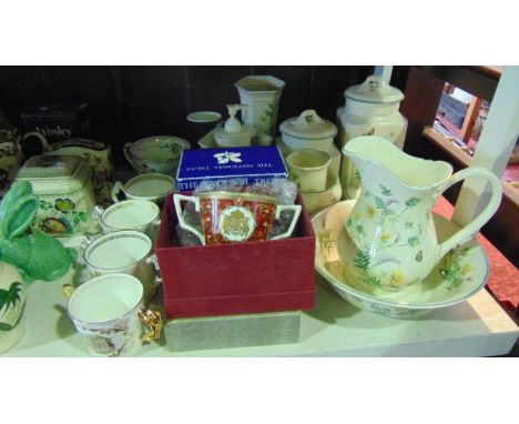 A collection of Royal Winton Country Diary Collection ware comprising a ewer and basin, two lidded storage jars, soap dispens