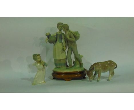 A Lladro model of a donkey together with a Lladro angel, and a matt glazed group in the Lladro manner of a girl carrying a fl