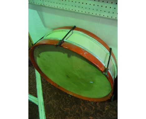 A vintage parade drum of circular form with red and cream painted finish to the timber frame, 74 cm diameter approx