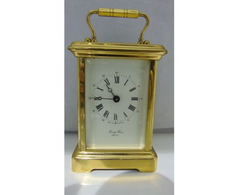 A brass cased carriage clock with 8-day striking movement and enamel dial marked Kemp Brothers, Bristol