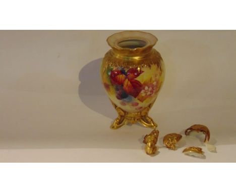 A Royal Worcester vase with finely painted blackberry and bramble decoration, signed K Blake and raised on three gilded suppo