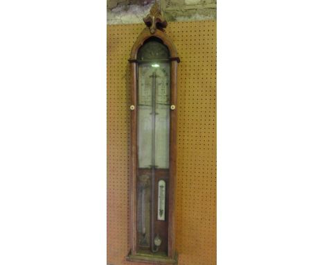 A Victorian Admiral Fitzroy barometer, the oak case with fleur-de-lis finial, with printed paper back