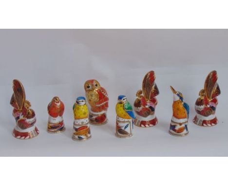 A collection of Royal Worcester Connoisseur Collection candle snuffers in the form of birds comprising three cockerels with I