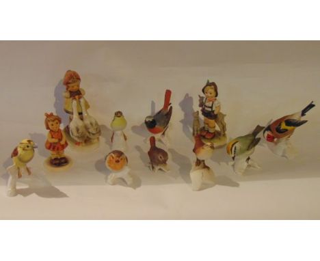 A collection of three Goebel Hummel figures of children comprising The Little Goat Herder and For Mother (both boxed), a litt