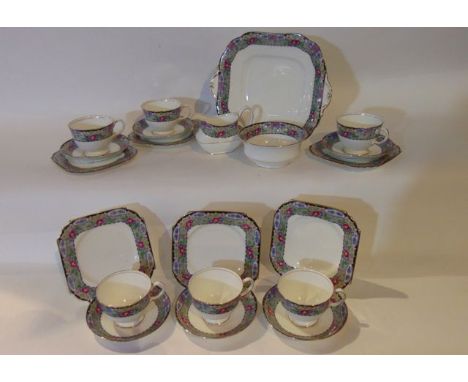 A six place Ainsley tea service with printed floral border decoration comprising cake plate, milk jug, sugar bowl, six cups, 