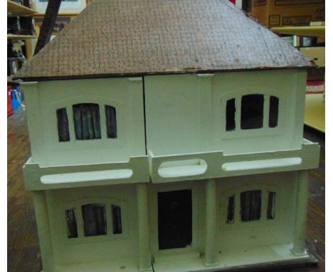 A vintage model dolls house of timber construction with hinged terraced front revealing six rooms (including hallways) with w