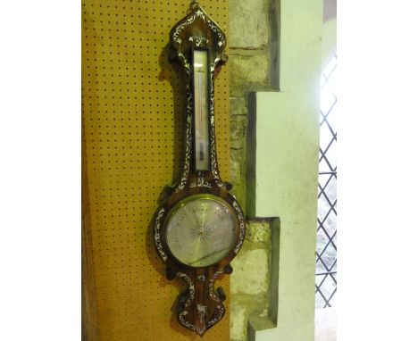 A mid-19th century rosewood wheel barometer with silvered dials and mother-of-pearl inlaid detail