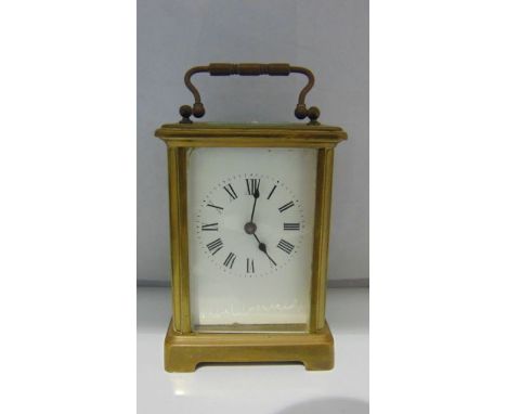 A simple brass cased carriage clock with 8-day timepiece