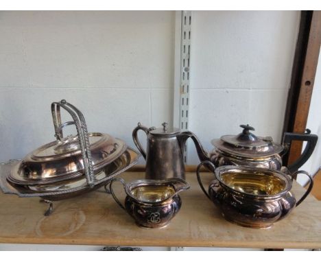 A three piece silver plated tea set comprising teapot, two handled sugar basin and milk jug, all with bulbous bowls with init