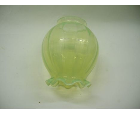 A small vaseline shade suitable for electric light fitting, shaped as a ball with fluted open end and crinkle rim decoration 