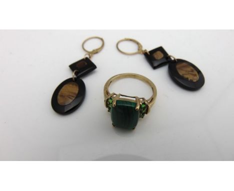 A pair of tiger's eye and onyx drop earrings, with 9ct gold fittings; and a malachite ring, flanked with untested green stone