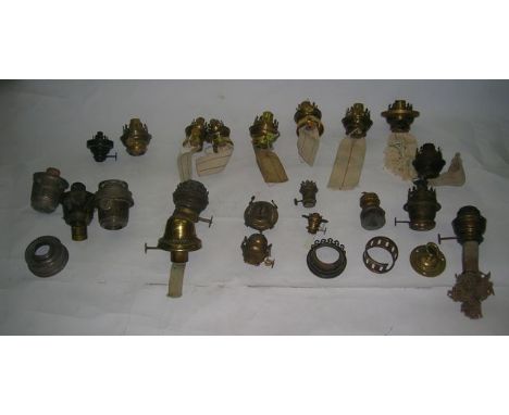A collection of oil lamp burners and parts including The Beacon light burner, six Kosmos burners - three with collars, approx