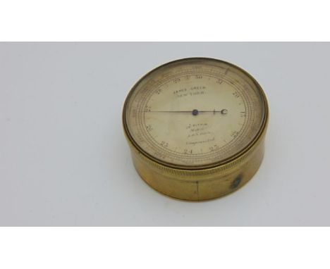 A Victorian gilt brass aneroid pocket barometer with altimeter scale with 6 1/2 cm silvered dial by James Pitkin of London, r