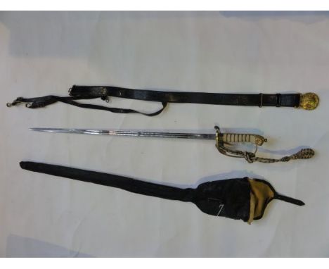 A Naval dress sword with Wilkinson Sword blade with etched detail, brass and leather scabbard, wirework portepee, oil skin ca