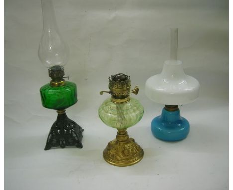 Three table lamps including a contemporary 1960s Holmegaard example Danish lamp with light blue fount and white shade and Kos