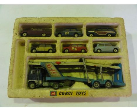 A vintage assortment of Corgi die cast model vehicles presented in partial original packaging to include a car transporter, t