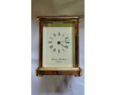 A brass cased carriage clock with 8-day striking movement by Charles Frodsham, London with guarantee for date of purchase Jun