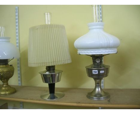 A plated Super Aladdin table lamp with incandescent lamp shade, and an Aladdin, possibly 1950s, aluminium table lamp with bla