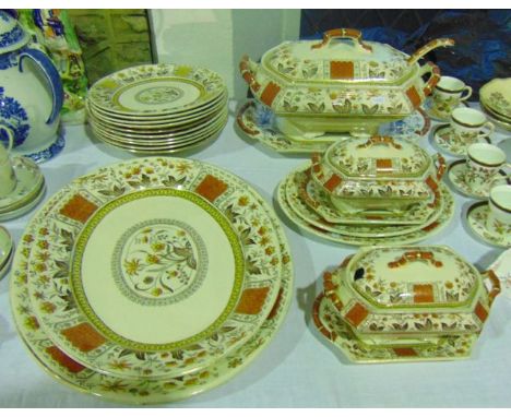 A collection of 19th century dinner wares in the Norman pattern with orange, brown and yellow stylised floral decoration comp