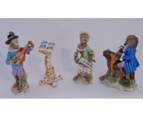 A group of three 19th century Meissen models of monkey musicians comprising a blue jacketed monkey playing a spinet whilst pe