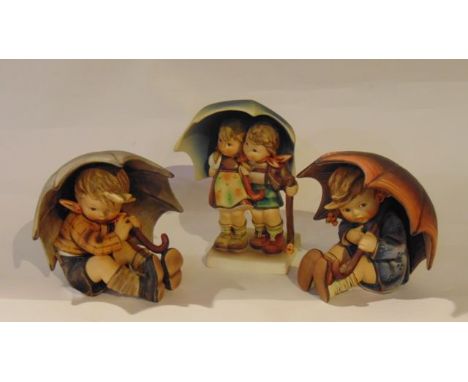 A Goebel Hummell figure group of a pair of children sheltering beneath an umbrella - Stormy Weather (boxed), together with a 