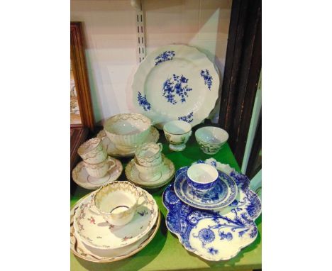 A matched pair of 19th century plates with blue and white painted sprigs and sprays and with relief moulded borders, together