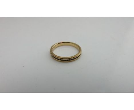 A diamond half-eternity ring, channel-set with round brilliant-cut diamonds weighing approximately 0.10cts in total, in unmar