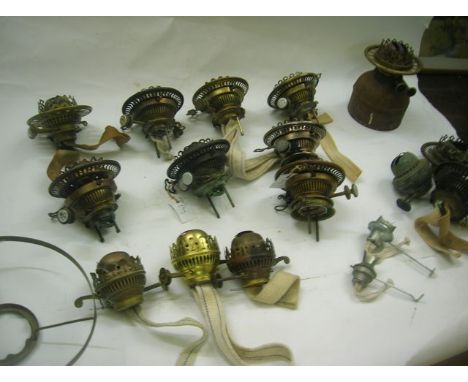 A collection of various oil lamp burners and spares including Wright & Butler duplex in its own fount, a Wright & Butler No 2