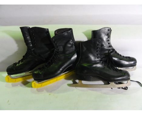 Two pairs of vintage ice skates