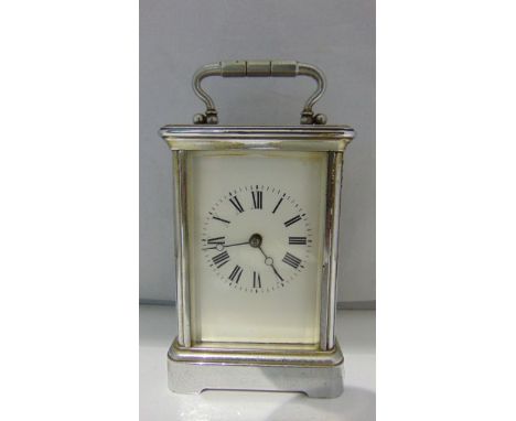 A brass cased carriage clock with later chrome finish enclosing an 8-day timepiece