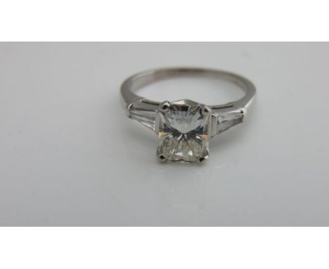 A diamond ring, centred with a claw-set radiant-cut diamond weighing approximately 2.08cts, measuring approximately 8.05mm x 