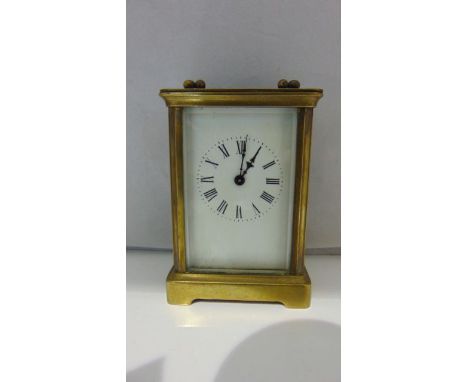 A simple brass cased carriage clock with 8-day timepiece