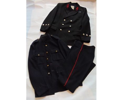 A vintage Royal Marines navy blue ground jacket with brass embossed buttons together with an associated pair of navy blue tro