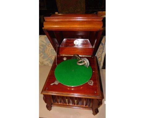 A vintage mahogany cased table top gramaphone with green felt lined table set above pivoting sound vent (reconditioned) with 