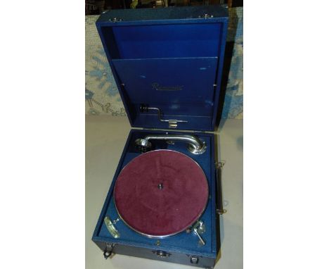 A vintage Resonia table top gramaphone with navy blue glass and burgundy felt lined table