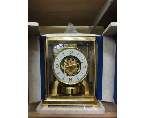 A Jaeger-le-Coultre Atmos clock number 241071 in a polished brass case with original travelling case and outer box